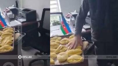 Məmurun masasını acımış xəmirlə doldurdular - VİDEO